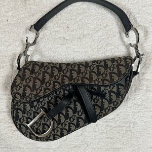 Very loved Dior Saddle Bag purchased from Saks .